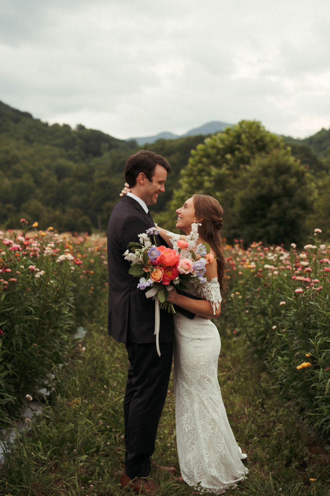 Bride and Groom in field after wedding ceremony