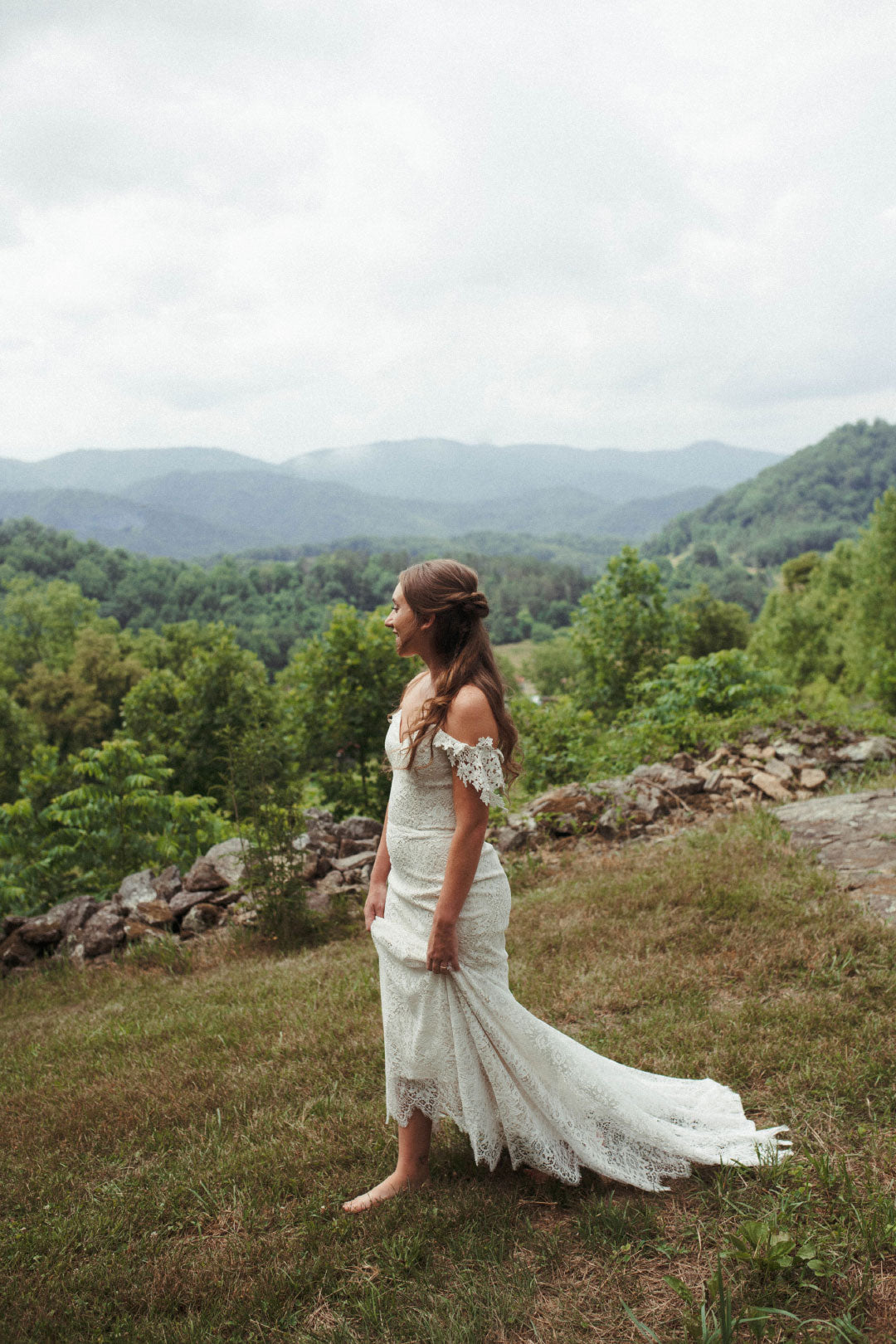 Bride Walking in Lace Boho Style Wedding Dress by Claire Pettibone
