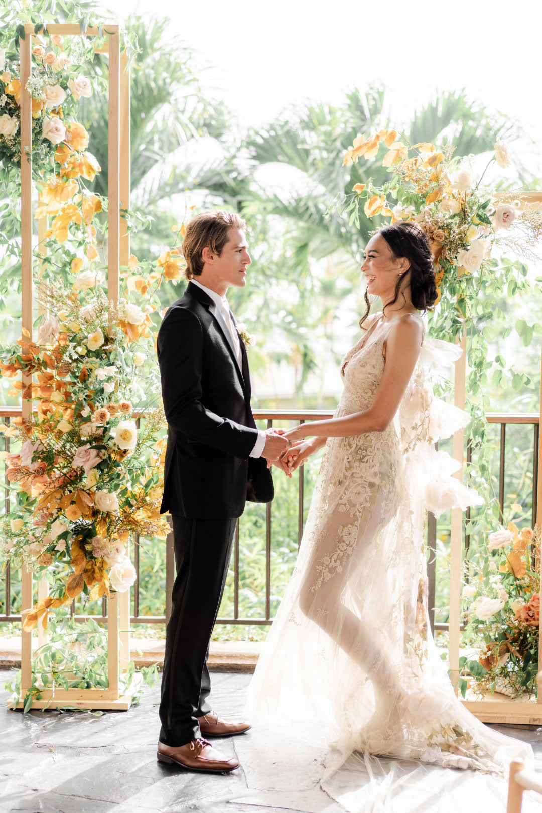 Groom and Bride pose bride wearing Desert Rose by Claire Pettibone