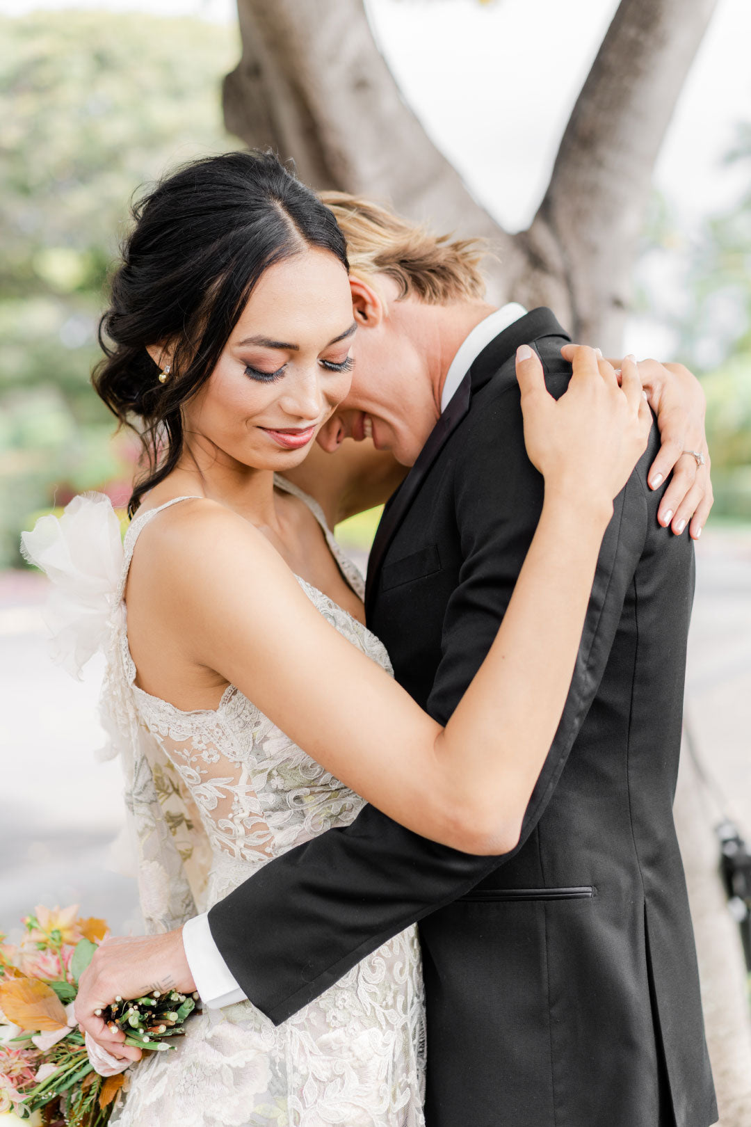 Bride and Groom embrace for photo