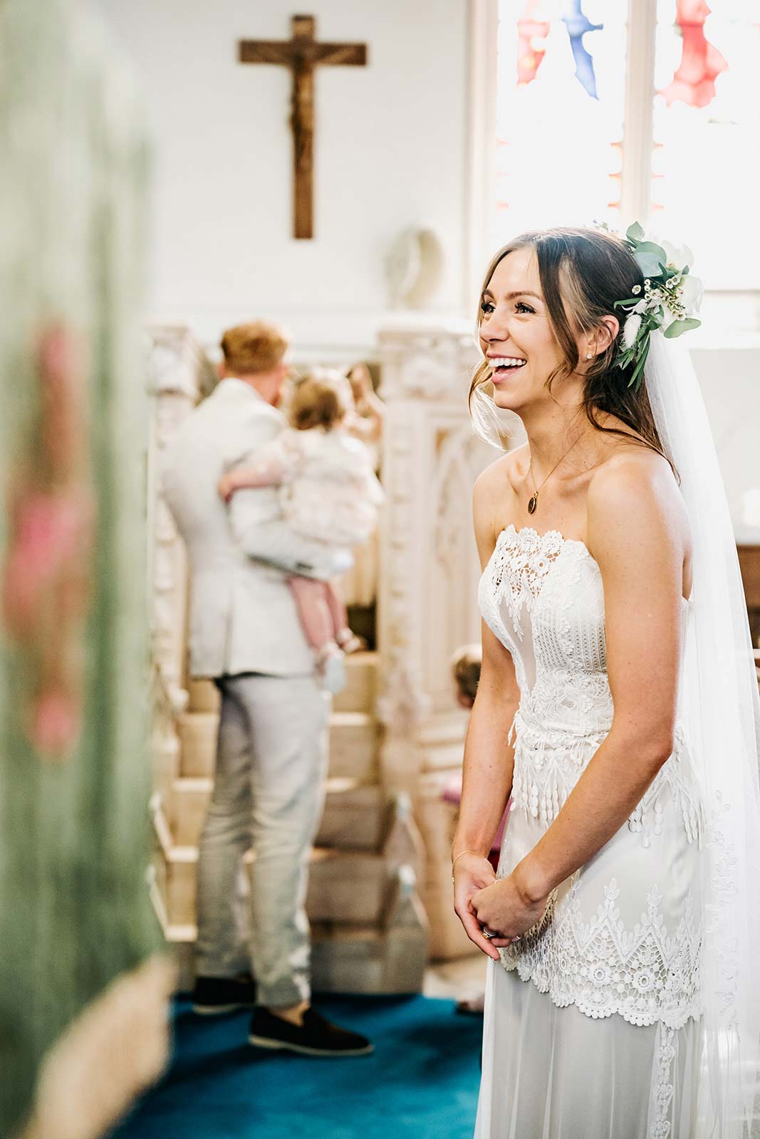 Bride wearing Victoriana by Claire Pettibone during wedding ceremony