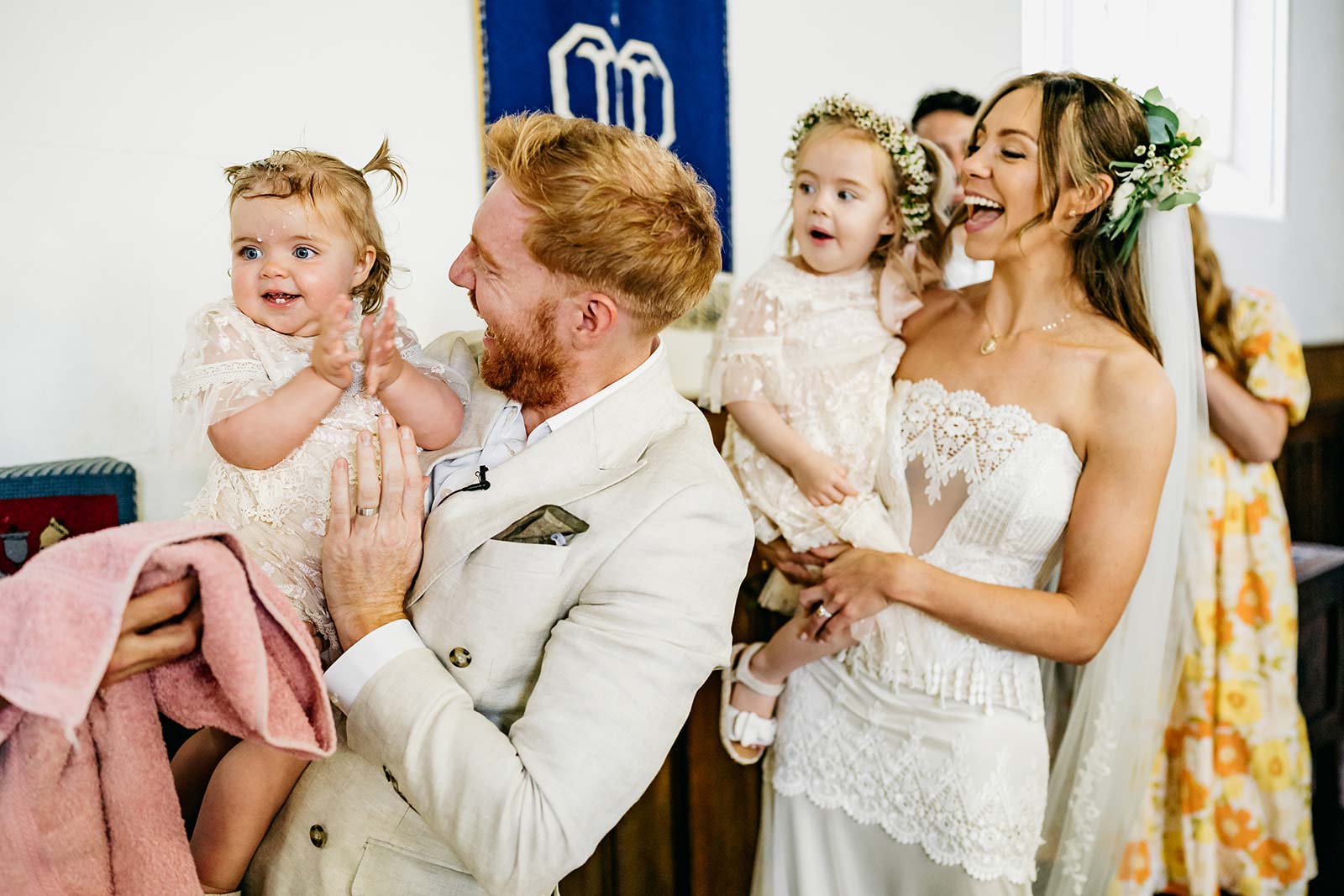 Bride and Groom holding their babies after ceremony