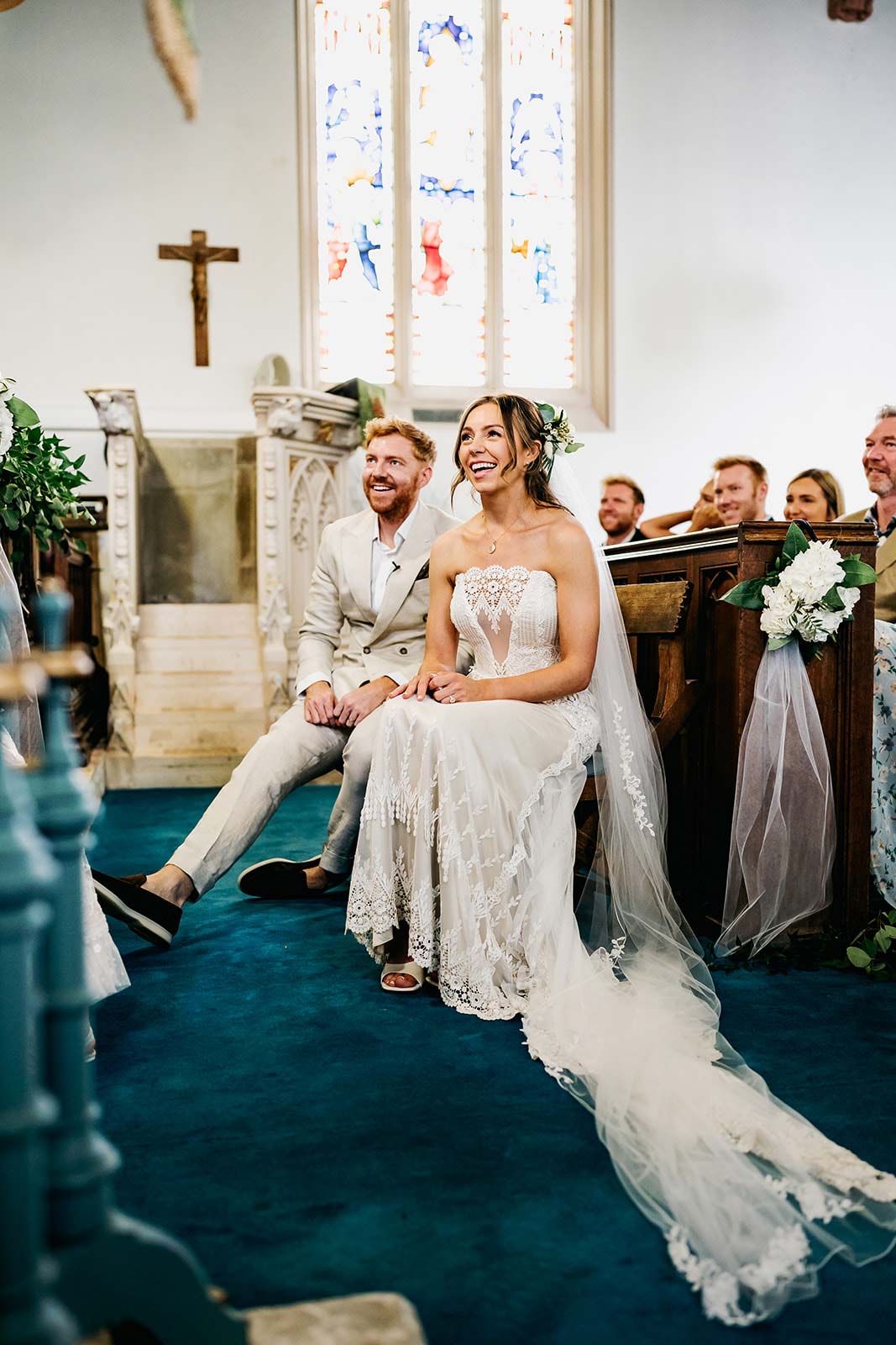 Bride and Groom seated and listening the officiant