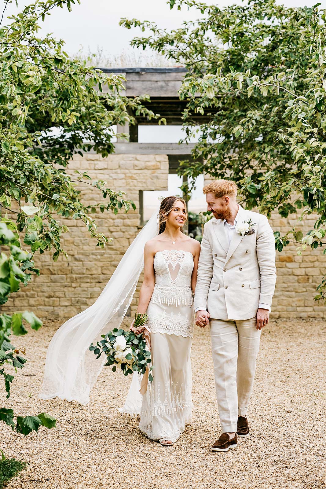 Bride and Groom Walking in celebration venue