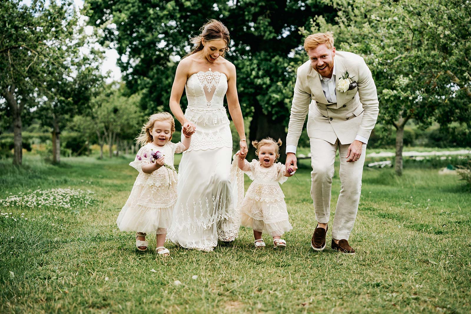 Bride and Groom photos with babies after wedding