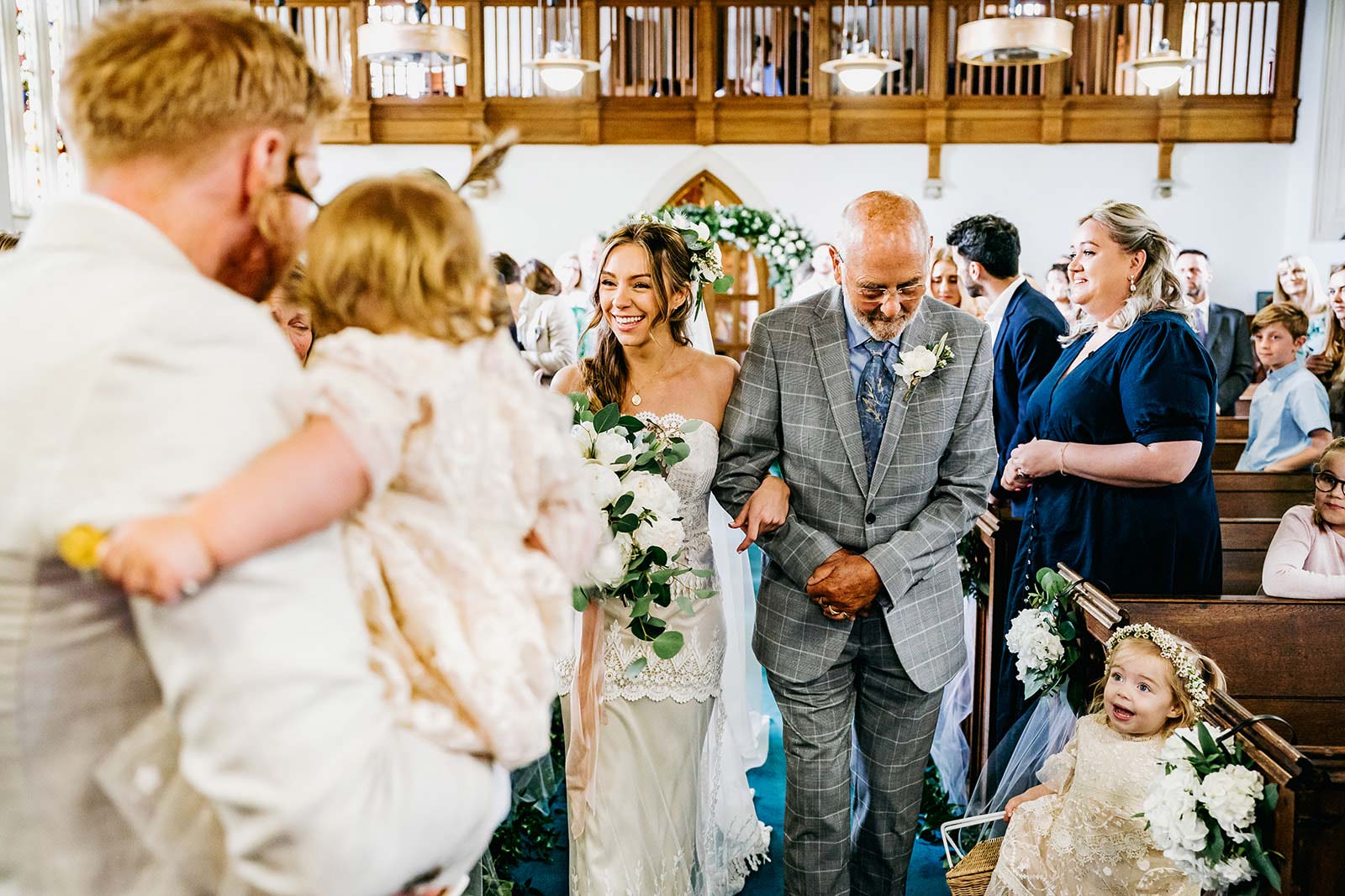 Bride walking with Father into the wedding ceremony