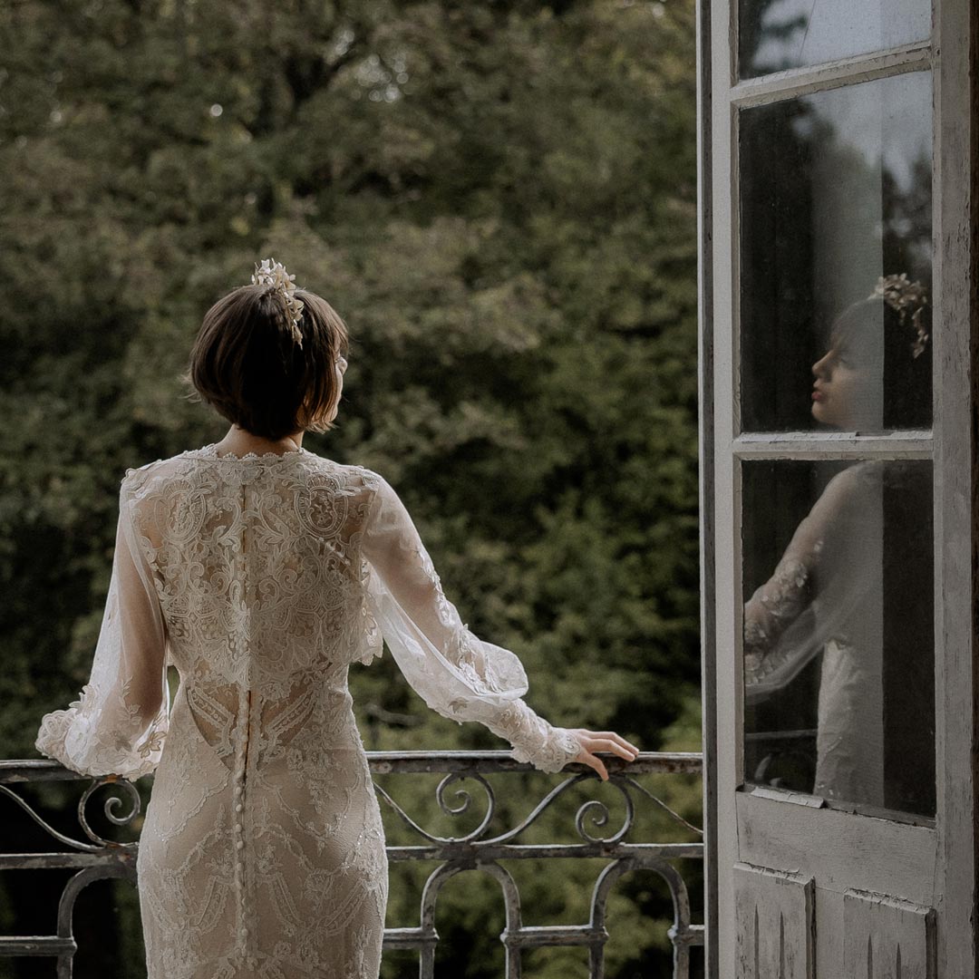 Bride Standing at Balcony in Claire Pettibone Wedding Dress Back Wedding Dress Design
