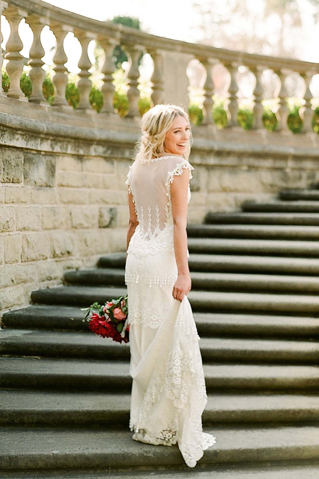 Kristene Wedding Dress with Illusion Back Model on Stairs