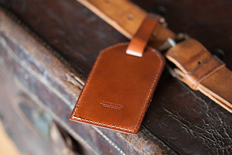 Hand-made leather luggage tag reminiscent of a time past.