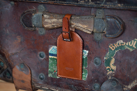 Hand-made leather luggage tag reminiscent of a time past.