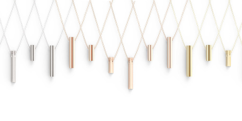 A selection of pendants in multiple colors of gold