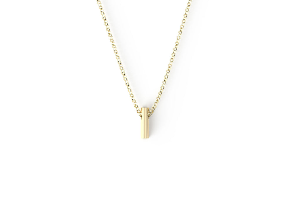 The shorty 14k yellow gold awareness ribbon. Pendant on a thick rolo 14k yellow gold chain.