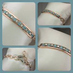 Custom rose gold bracelet with diamonds and blue zircon.