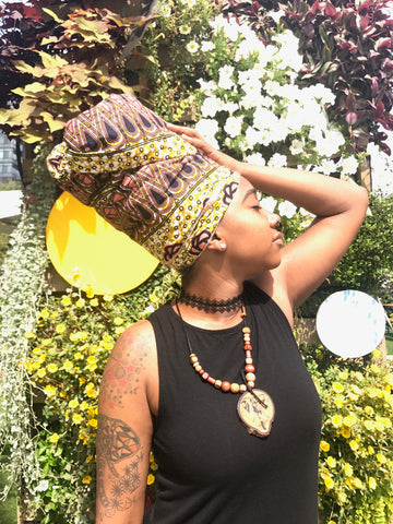 woman in african print headwrap