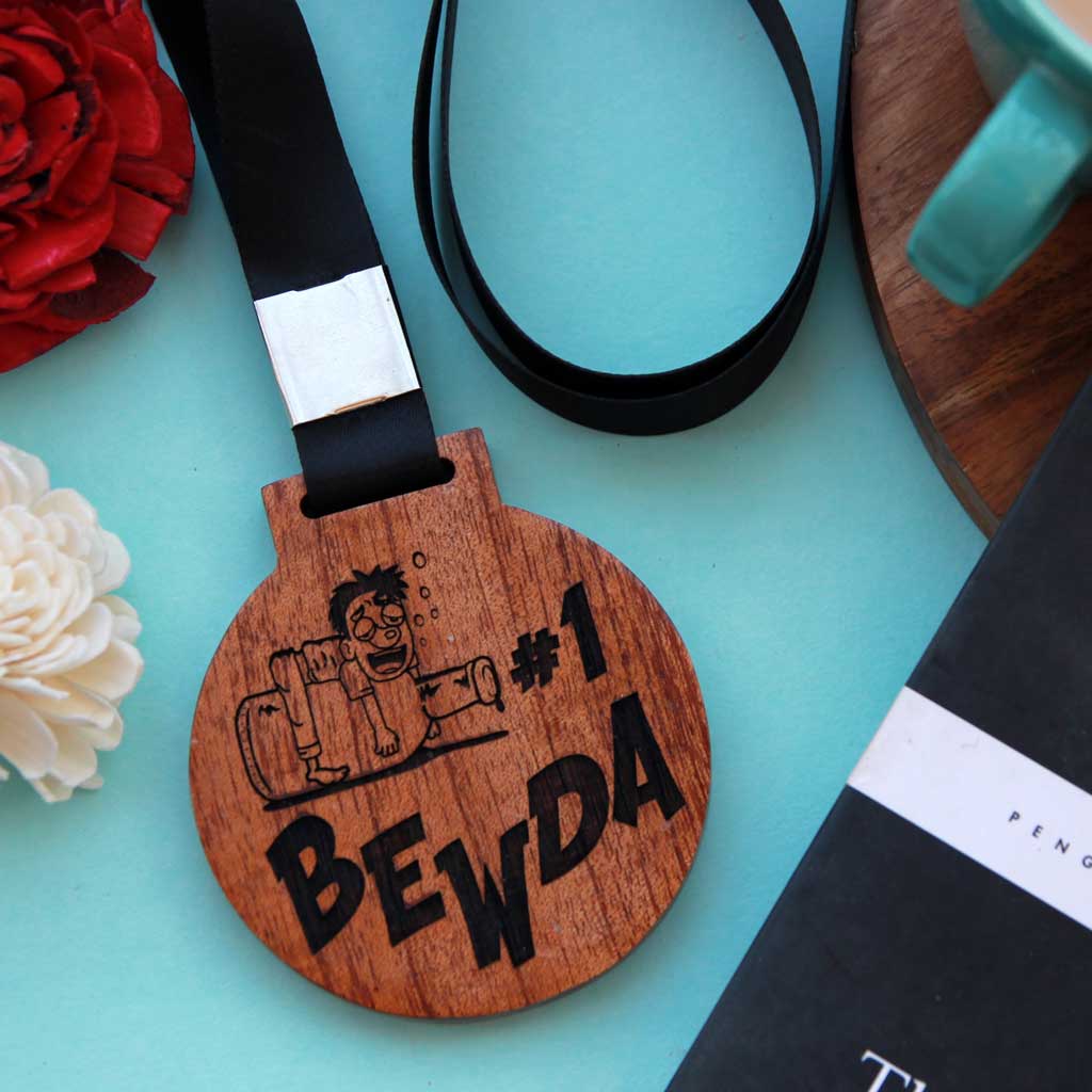 #1 Bewda Wooden Medal With Ribbon. This Funny Medal Is Engraved On Mahogany or Birch Wood. These Funny Medals Make Great Friendship Day Gifts Or A Simple Birthday Gift For Friends.