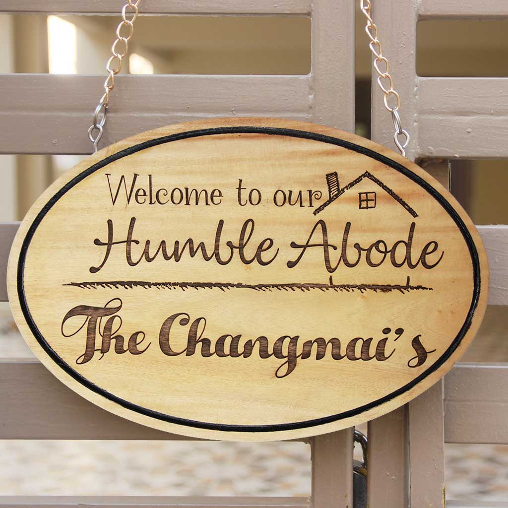 Personalized Welcome To Our Humble Abode Hanging Wood Sign. These Engraved House Signs Make The Best Wooden Accessories For Home. Shop More Onam Gifts Online From The Woodgeek Store.