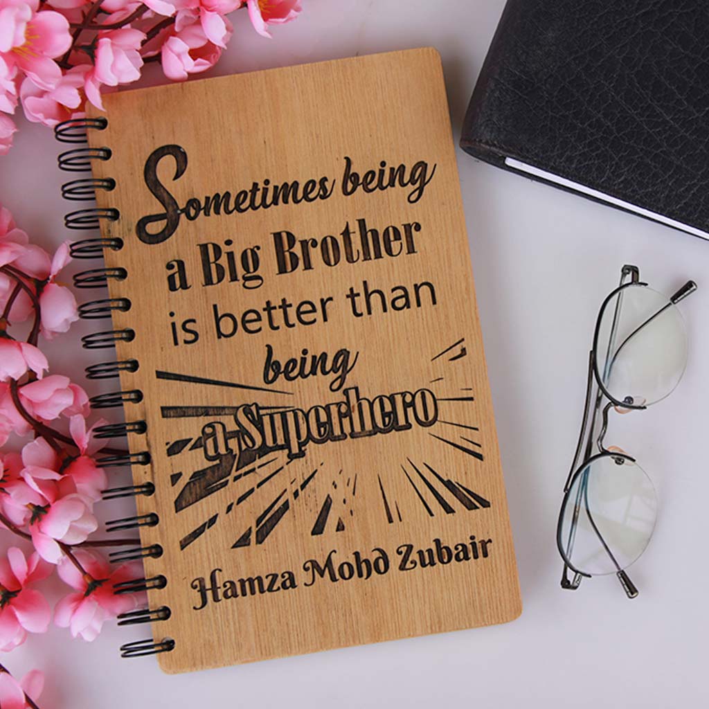 Being A Big Brother Is Better Than Being A Superhero Personalized Wooden Journal. This Spiral Notebook Makes An Amazing Rakhi Special Gift For Brother. Buy Custom Gifts Online For Sister And Brothers From The Woodgeek Store.