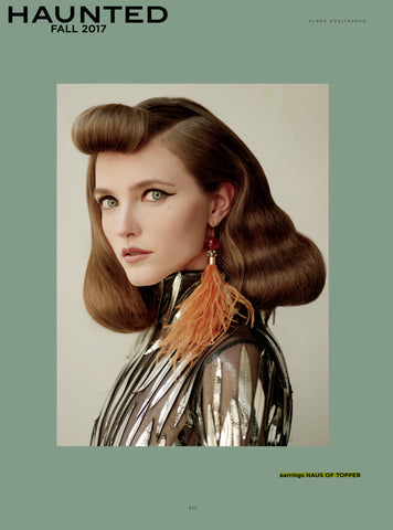 Haus of Topper burnt orange feather earrings in Haunted magazine 
