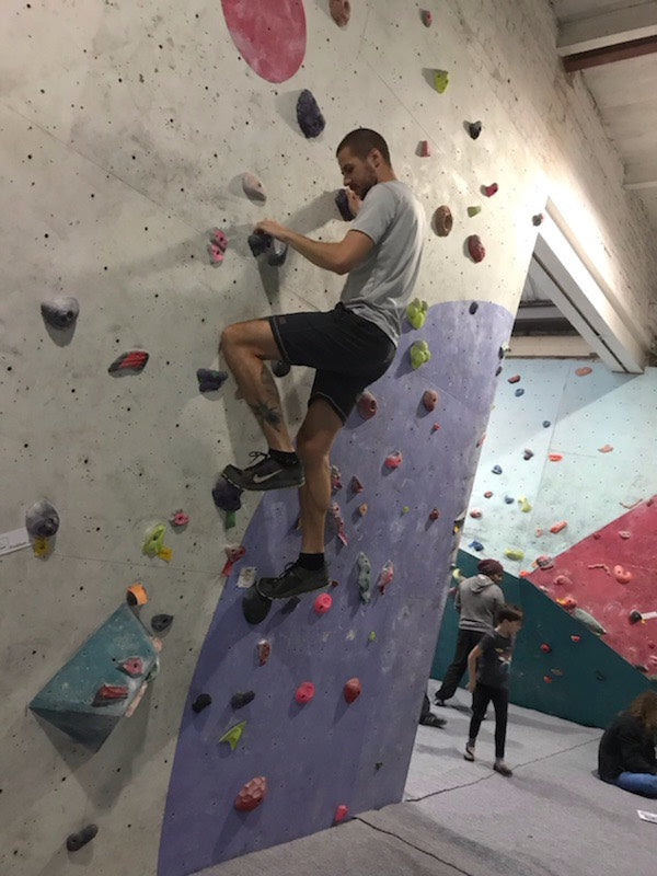 Male AThlete Rock Climbing wearing Sundried Recycled Eco Tech Activewear 