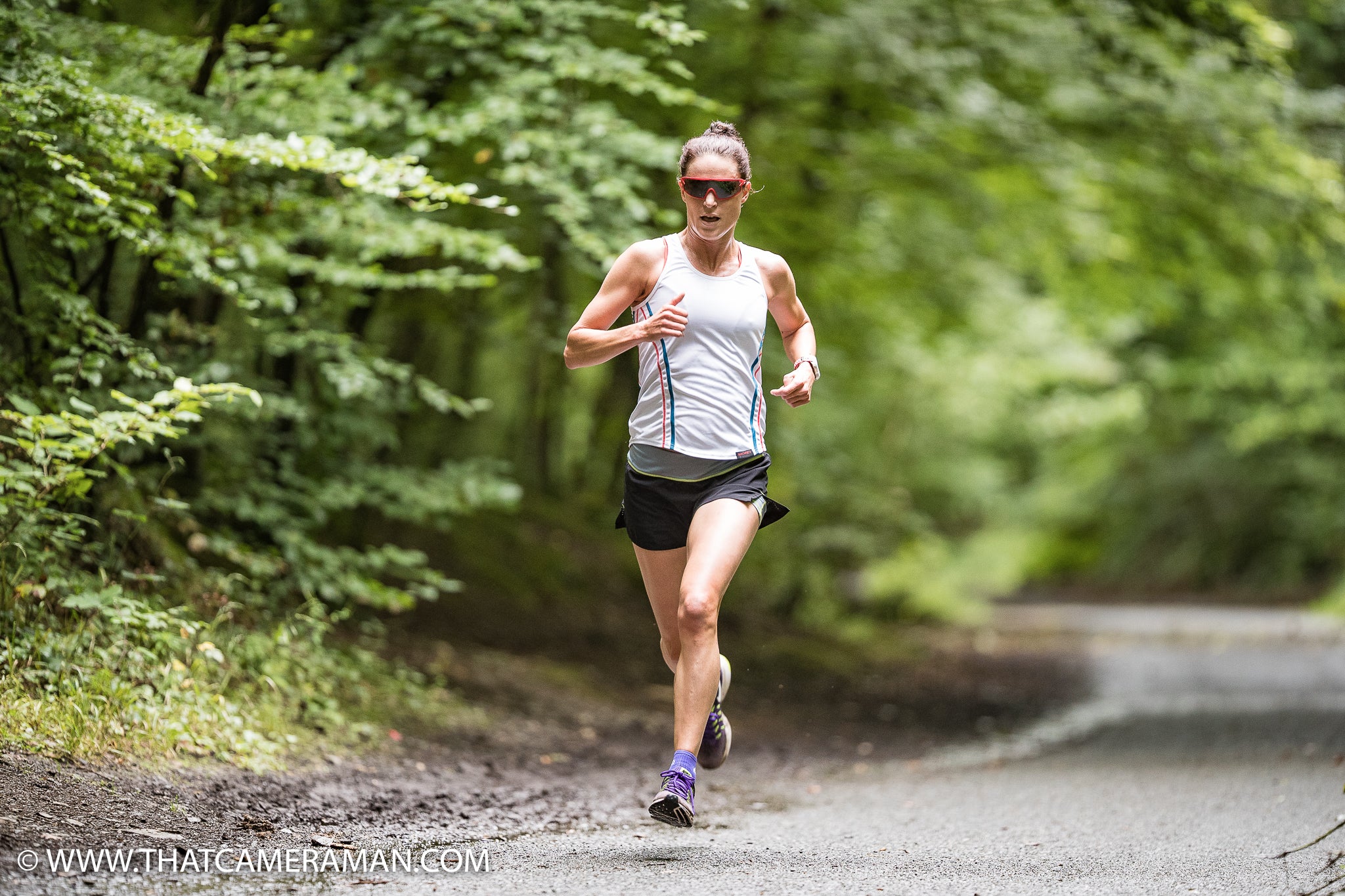 Female Athlete Racing in Sundried Running Vest and Recycled 2 in 1 Shorts