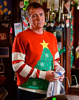 Alfie Moon wearing a Christmas Jumper