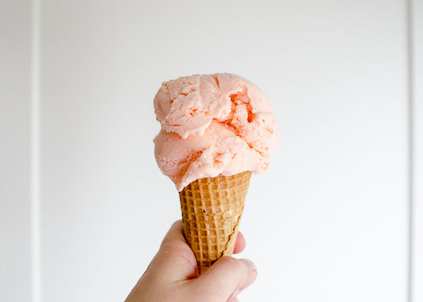 Eating bubblegum ice cream in a sugar cone
