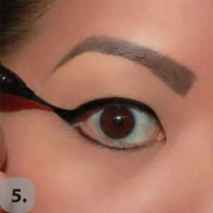 Fill in the empty space, creating the wing and draw a line along the lower lash line as close to the lashes as possible.