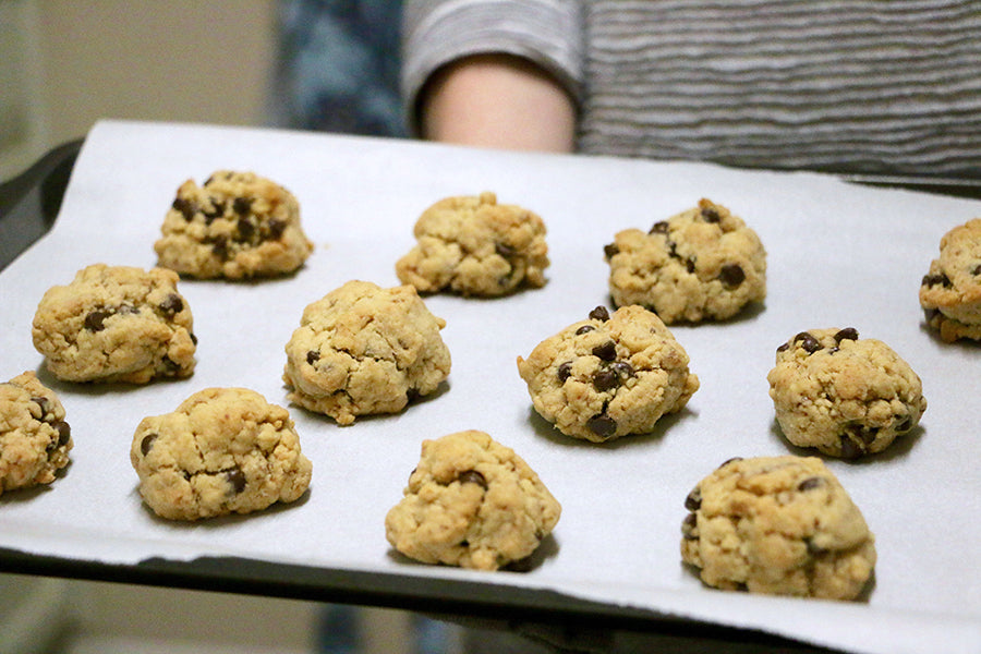 A sheet of chocolate chip cookies about to go in the oven.