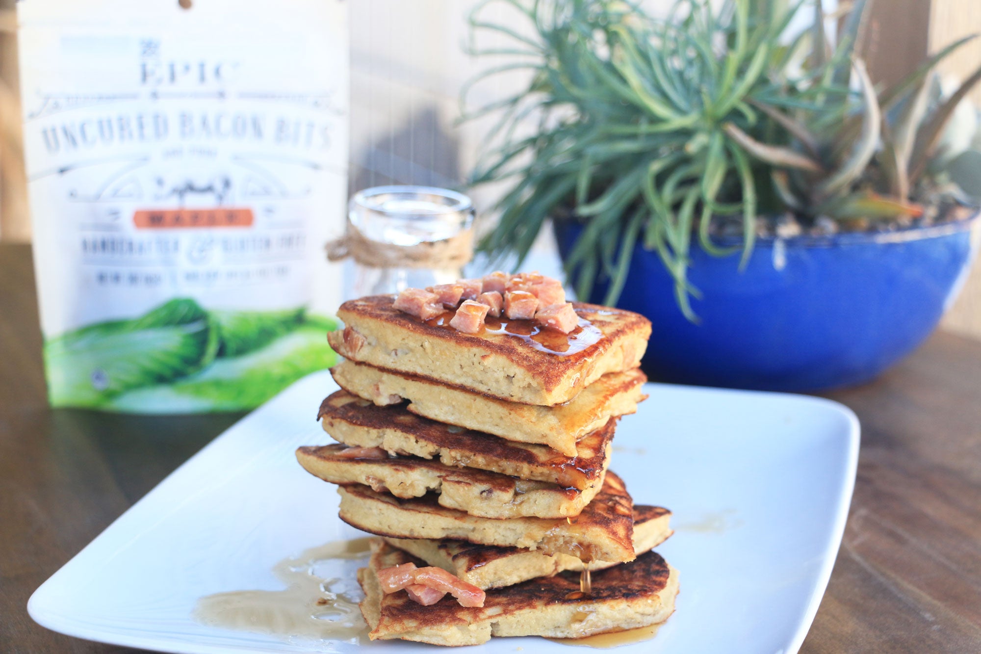 Stack of pancakes topped with EPIC bacon bits