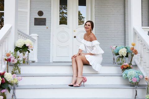 bride on porch in boho chic short white off shoulder wedding reception rehearsal outdoor bachelorette dress