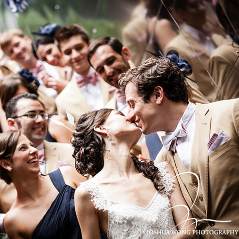 Groom with a General Knot Tie and Pocket Square kissing his bride
