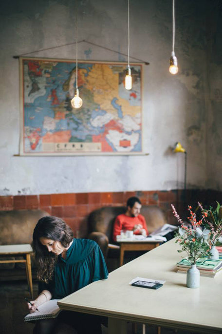 Guest artist Monique Richards sketching in a cafe in Barcelona