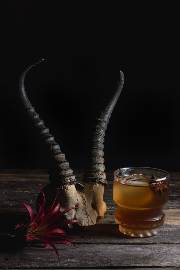 A zesty, spicy tiki-inspired cocktail featuring Smith & Cross Jamaican Rum, Linie Aquavit, Cocchi Rosa, homemade spiced simple syrup, citrus bitters and star anise garnish.