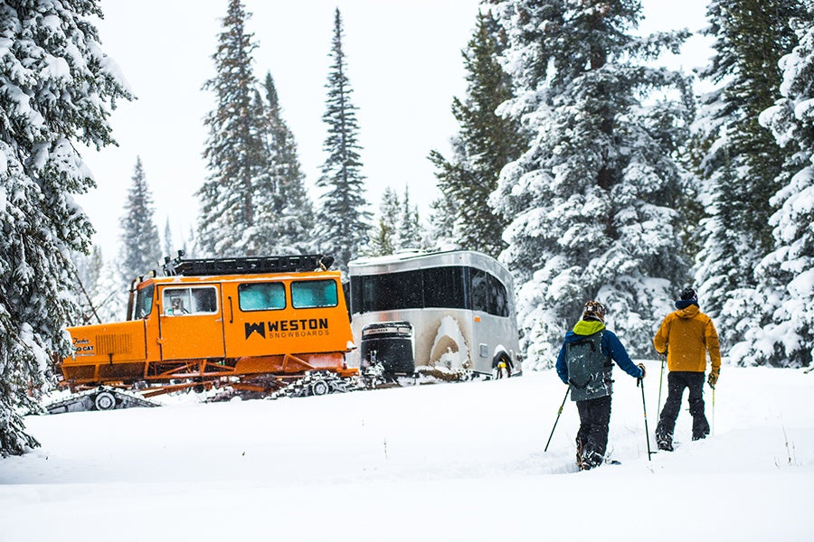 Weston Snowboard owners splitboarding up to Tucker Snowcat and Airstream Basecamp