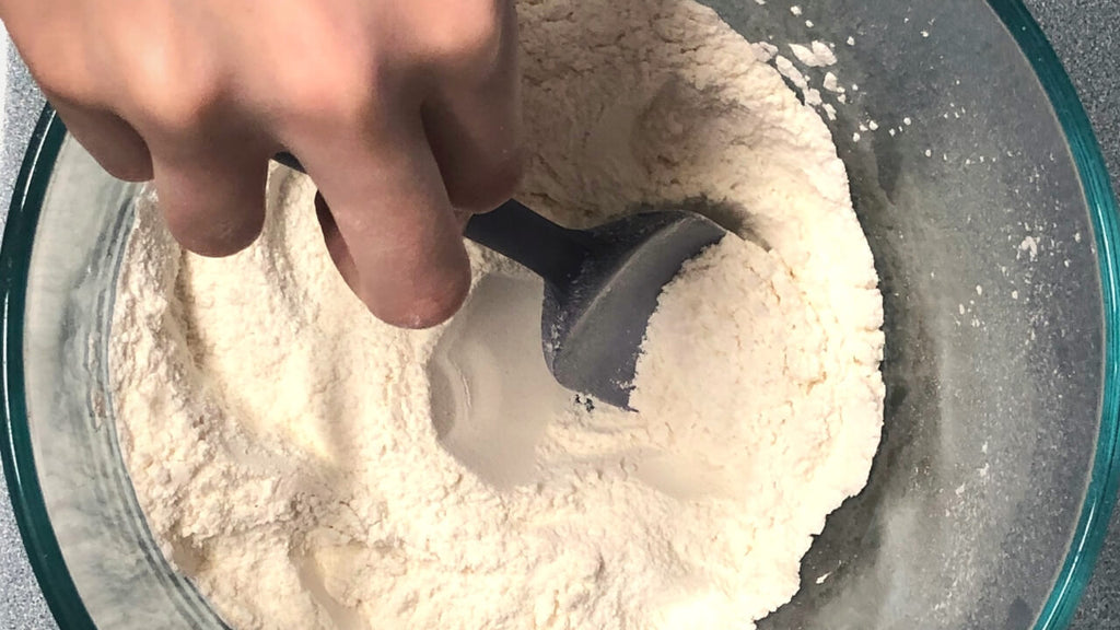 Homemade Playdough Tutorial - Step 1 includes ingredients of flour, salt, and cream of tartar.