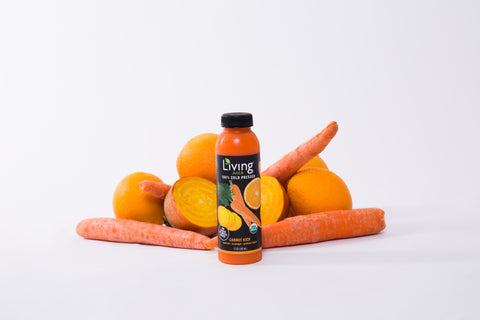 Organic, cold-pressed Living Juice Carrot Kick bottle of juice