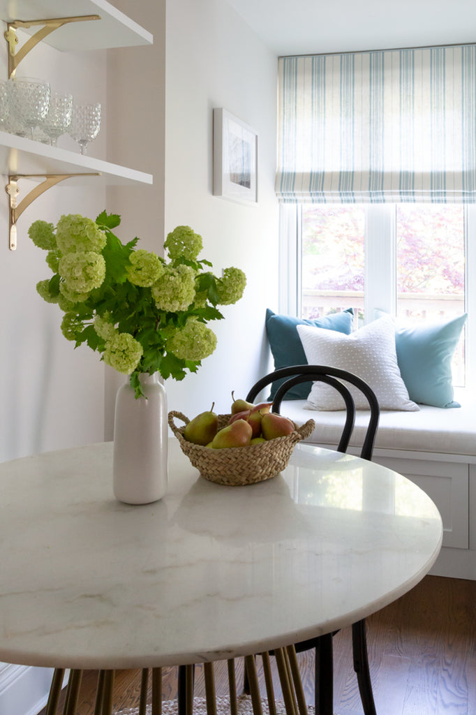 Breakfast nook with bistro chairs and built-in bench