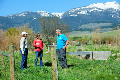 Sunni Heikes-Knapton (center), the watershed coordinator for the Madison Conservation District in Montana, discusses irrigation and habitat improvements with Janet Endecott and Pat Clancey, a fisheries biologist with Montana Fish, Wildlife and Parks, on Endecott’s ranch in McAllister, Montana. Photo credit: Eliza Wiley.