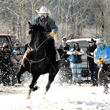 Scott Ping pulls a skier in the National  Skijoring Championships in Red Lodge, Montana. Photo by David Reese