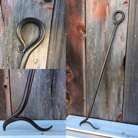 Scroll handle fire poker forged from solid iron and made to last for many seasons.