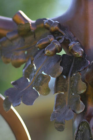 This piece was finished in an antique bronze patina. The finish starts with a base color of bronze metal under layers of brown and mahogany waxes that age the bronze to a lovely shade.