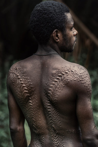 Man showing his Crocodile scars in Papua New Guinea by Trevor Cole