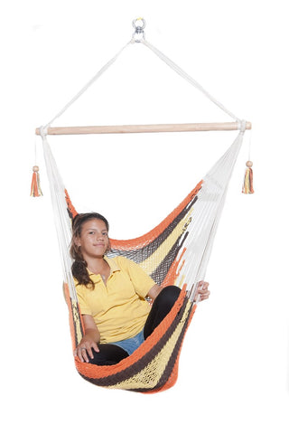 woman in a hanging hammock chair