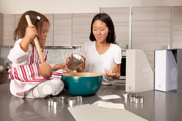 mom and daughter baking together