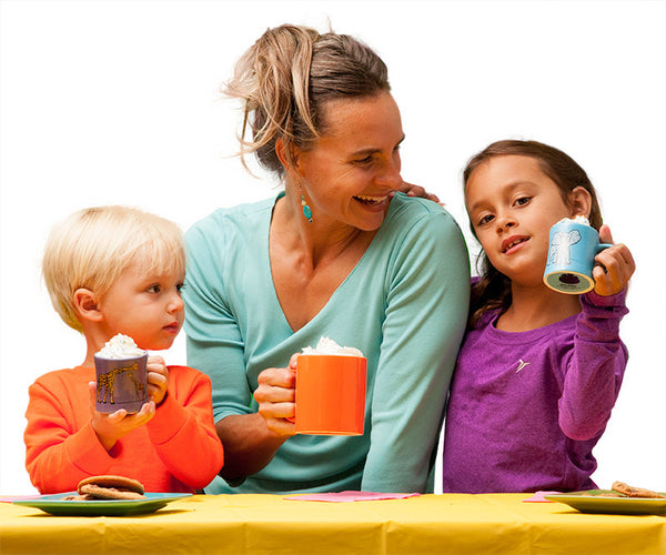 Mom sharing kid sized mugs with toddler and young child.  Ceramic kids mugs are plastic free and make great toddler gifts.