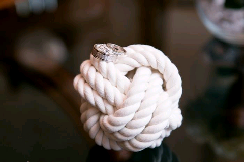 wedding knot holding wedding rings