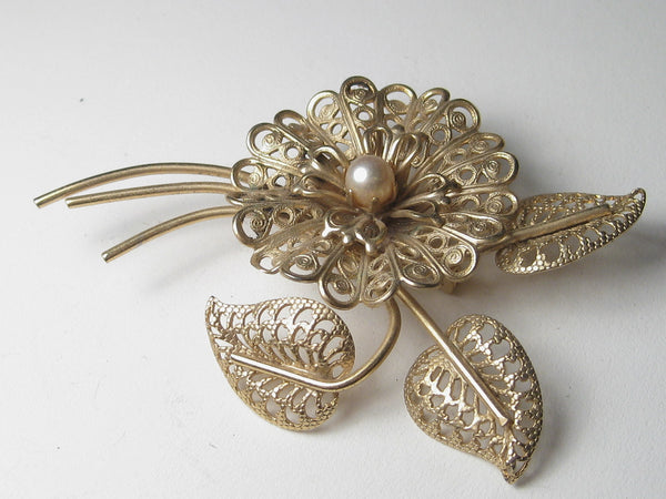Vintage Gold Tone White Thin Metal Detailed Flower and Stem and Leaf Brooch
