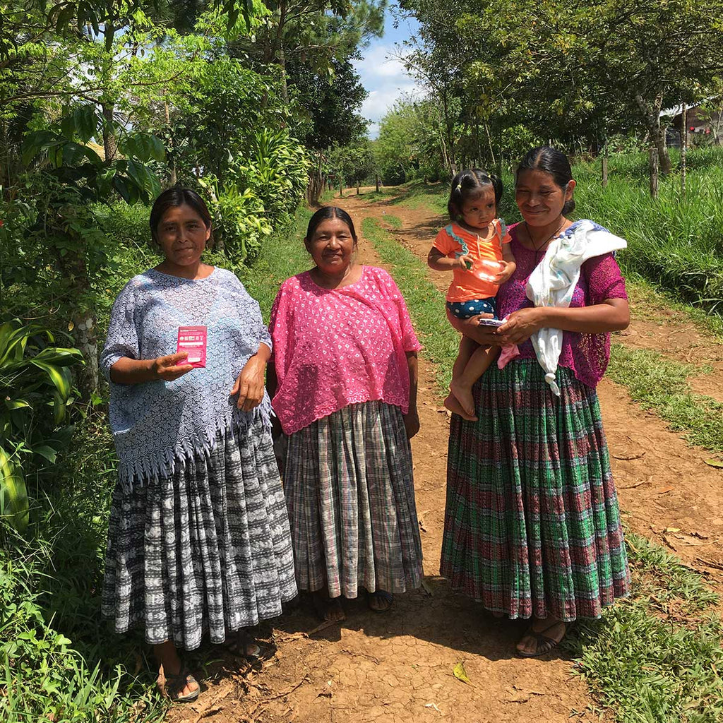 Three female farmers in the community about to enjoy our chocolate. Cacao production has traditionally been dominated by men, so much respect to these women pioneers!
