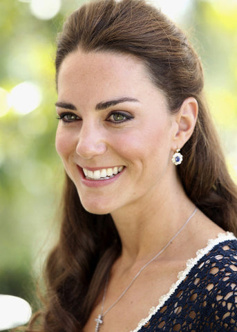 Catherine Duchess of Cambridge Kate Middleton wears cross pendant necklace