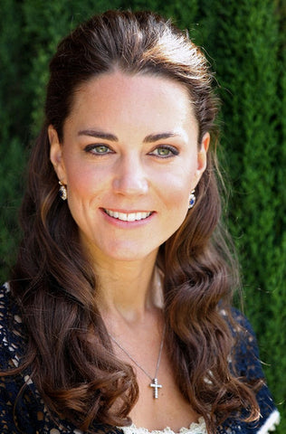 Catherine Duchess of Cambridge Kate Middleton wears cross pendant necklace